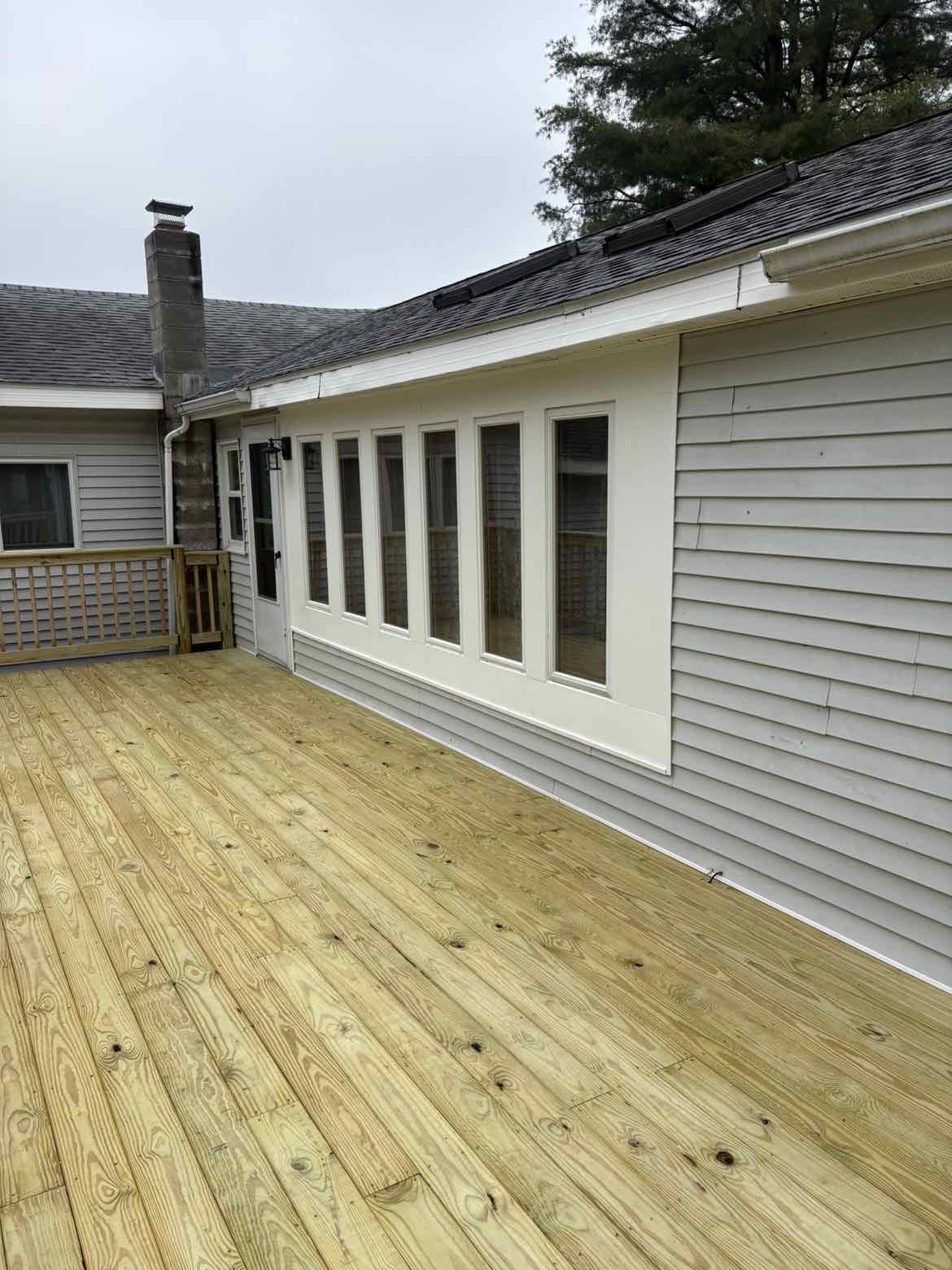 New Deck Along Repaired Siding